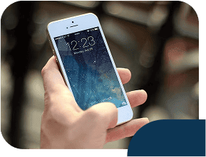 Hand holding smartphone displaying home screen.