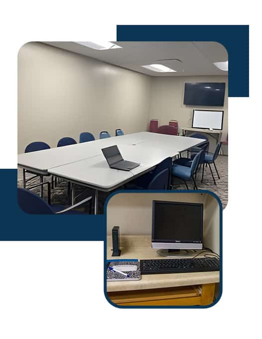 Conference room with meeting table and computer setup.