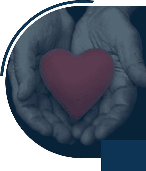 Hands holding a red heart symbol.