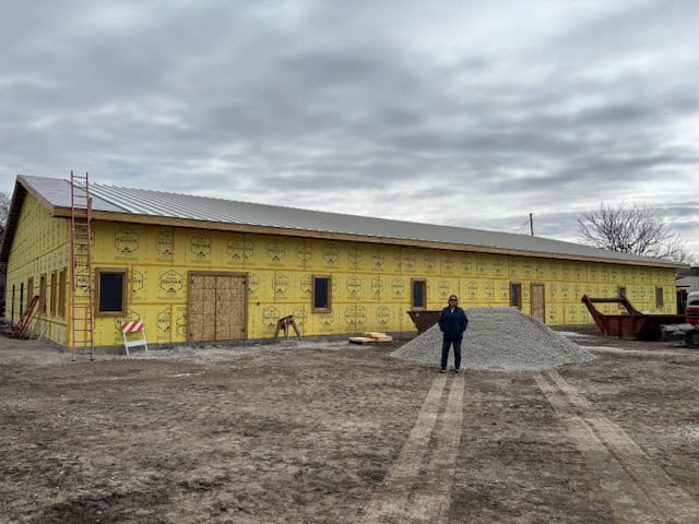 Construction site with building and person standing