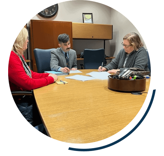 Three people having a business meeting.