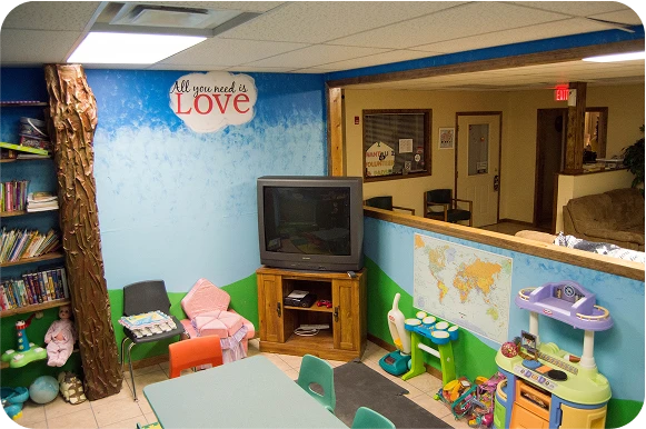 Colorful playroom with toys and decorations.